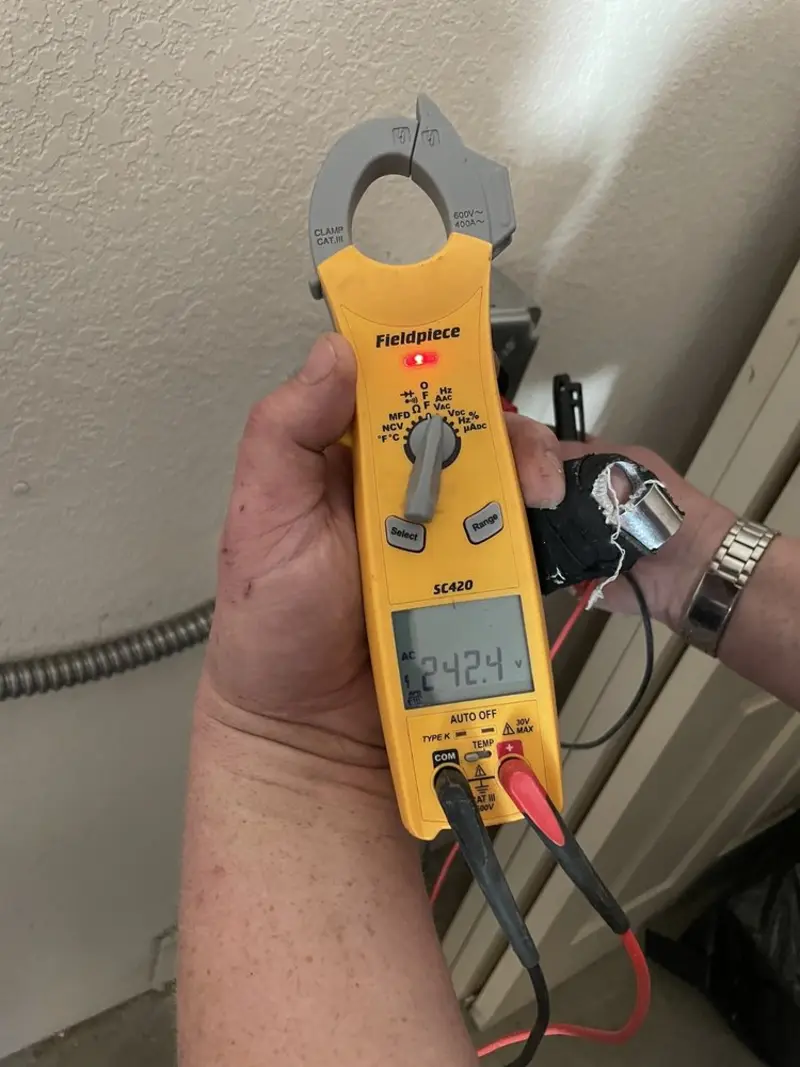 Voltage testing with clamp meter during Electrical Installation Services in Cordele